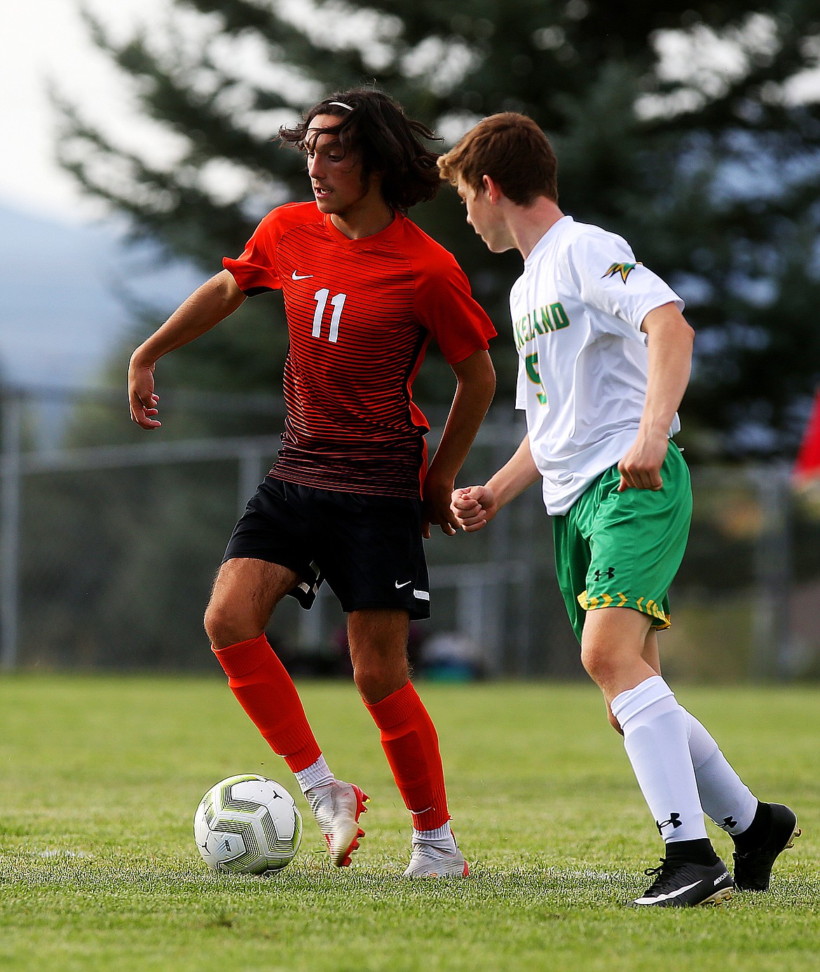 Post Falls&#146; Ethan Lawson dribbles the ball next to Lakeland&#146;s Jacob Ukich in a match Thursday at Post Falls High School. (LOREN BENOIT/Press)