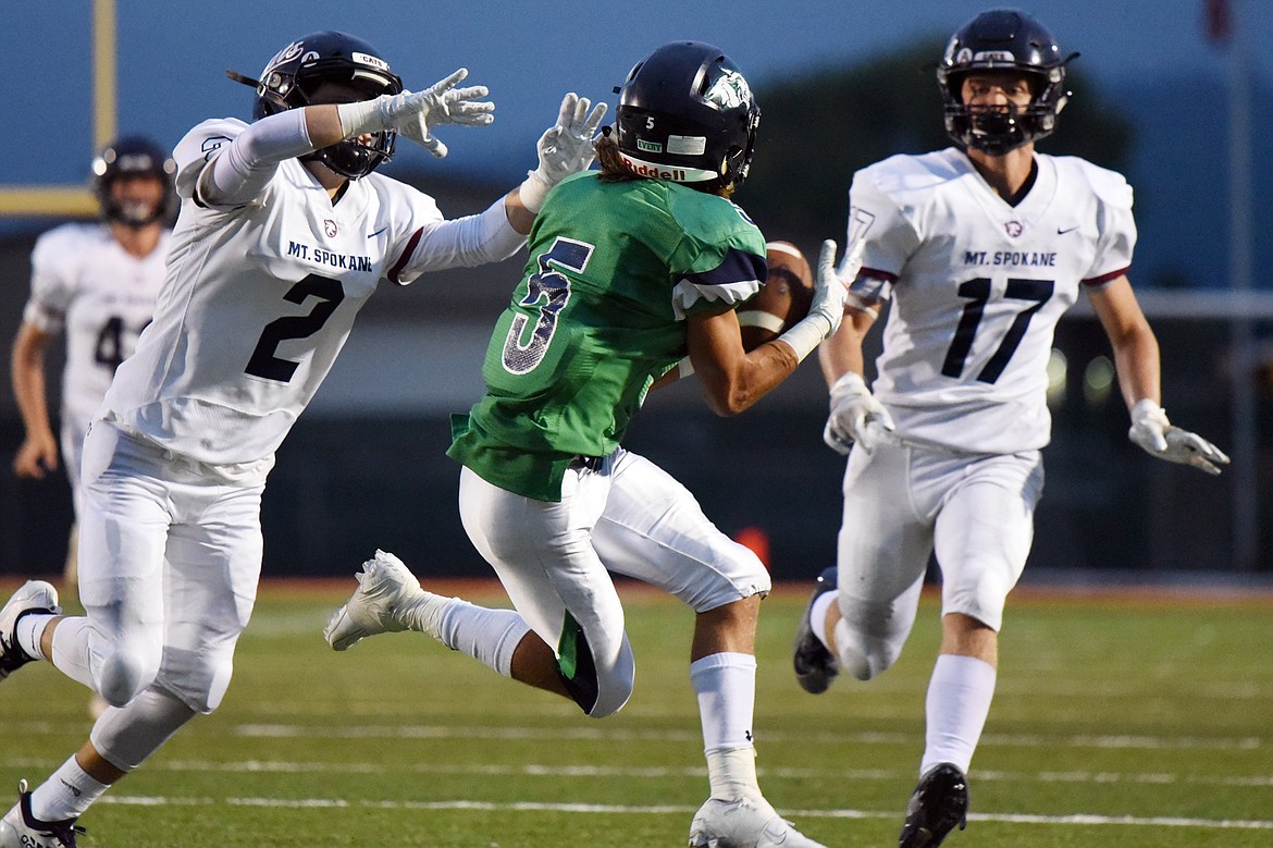 Glacier wide receiver Drew Deck (5) hauls in a long reception that would be called back due to a penalty on the Wolfpack against Mount Spokane  at Legends Stadium on Friday. (Casey Kreider/Daily Inter Lake)