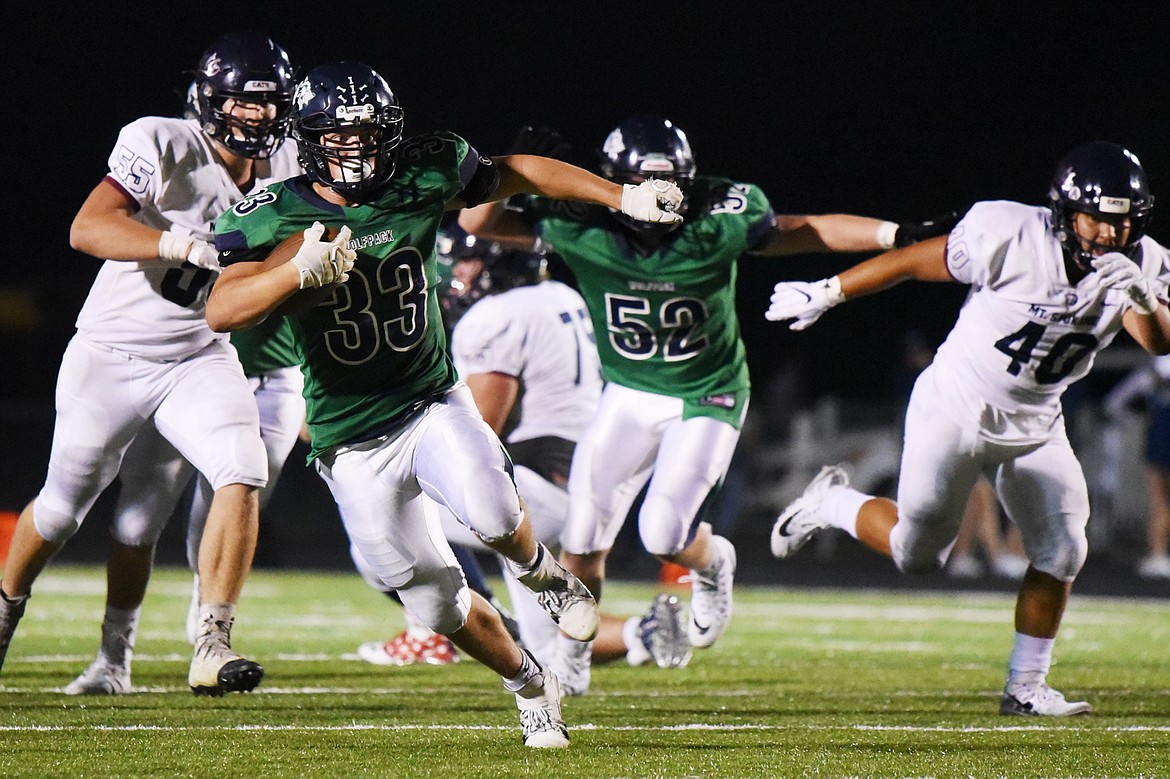 Glacier running back Jake Rendina (33) breaks free in the third quarter against Mount Spokane at Legends Stadium on Friday. (Casey Kreider/Daily Inter Lake)