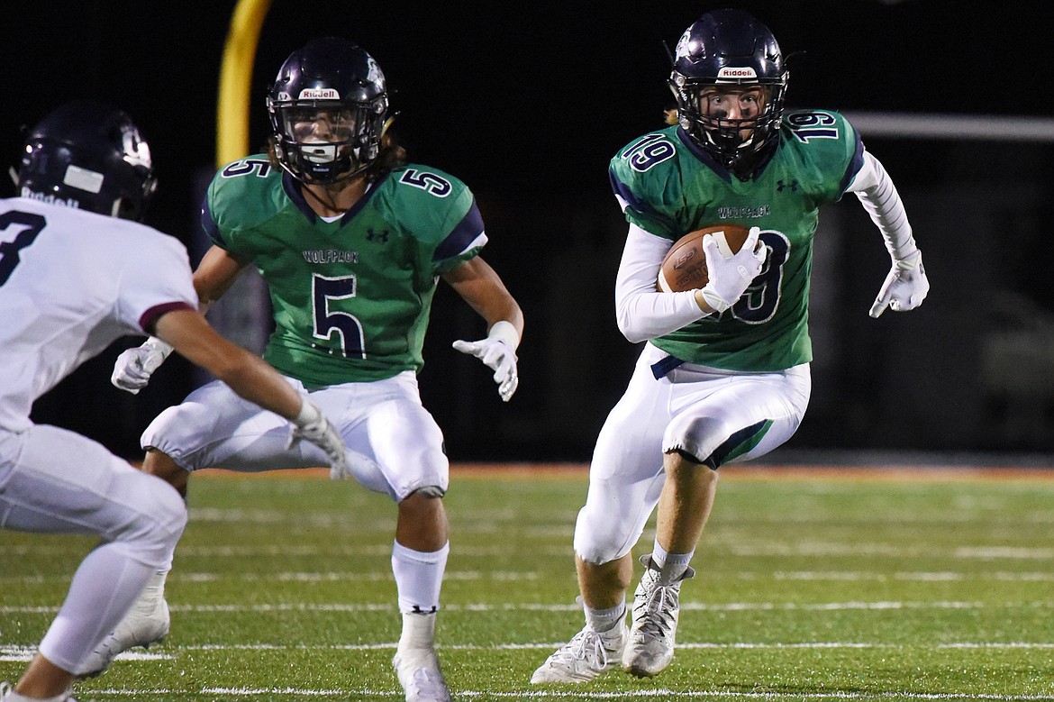 Glacier wide receiver Jonah Pate (19) turns upfield after a reception in the third quarter against Mount Spokane at Legends Stadium on Friday. (Casey Kreider/Daily Inter Lake)