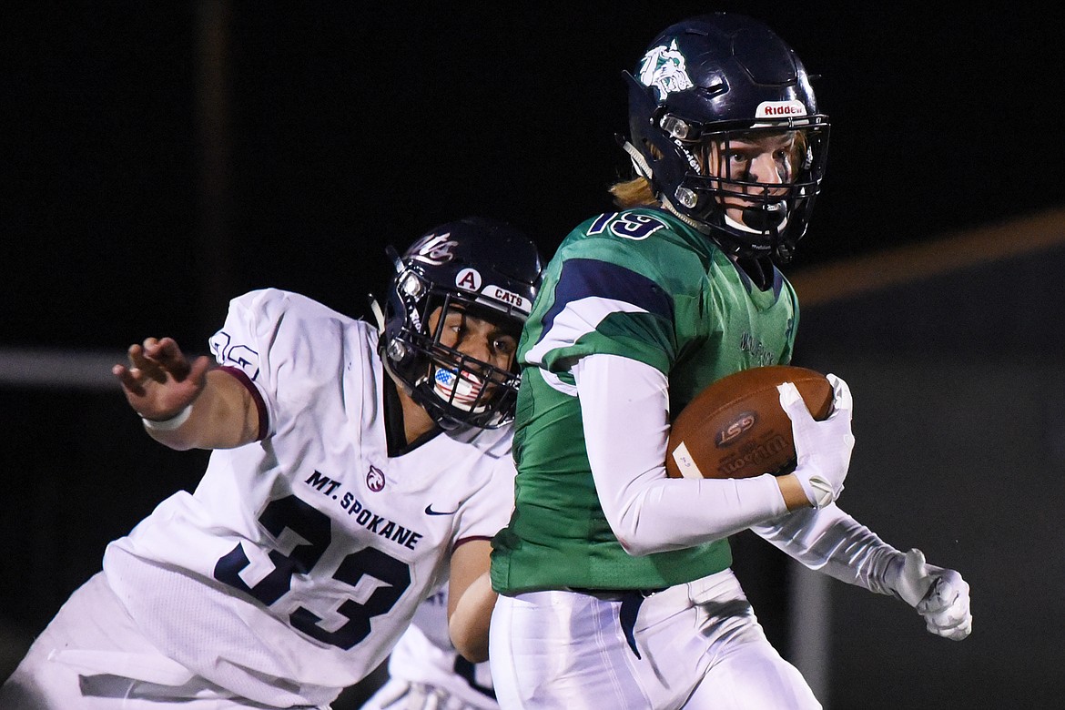 Glacier wide receiver Jonah Pate (19) turns upfield after a reception in the third quarter against Mount Spokane at Legends Stadium on Friday. (Casey Kreider/Daily Inter Lake)