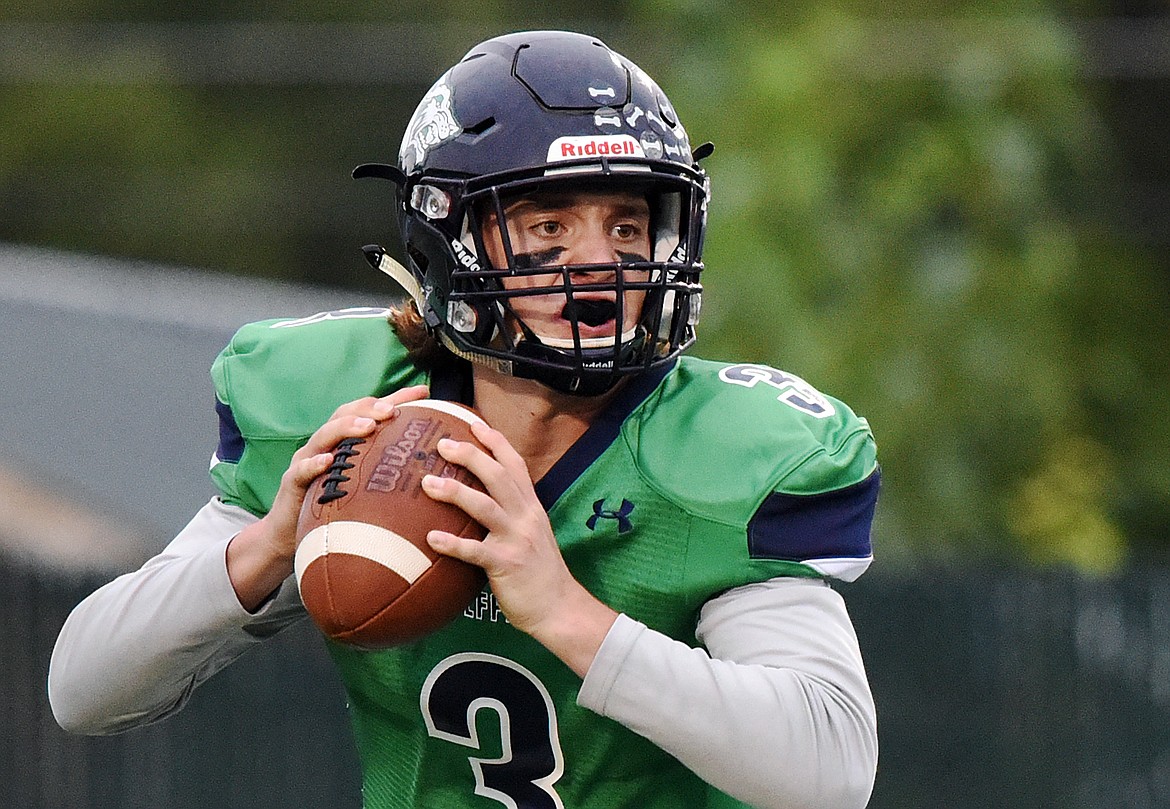 Glacier quarterback JT Allen (3) rolls out to pass in the first quarter against Mount Spokane at Legends Stadium on Friday. (Casey Kreider/Daily Inter Lake)