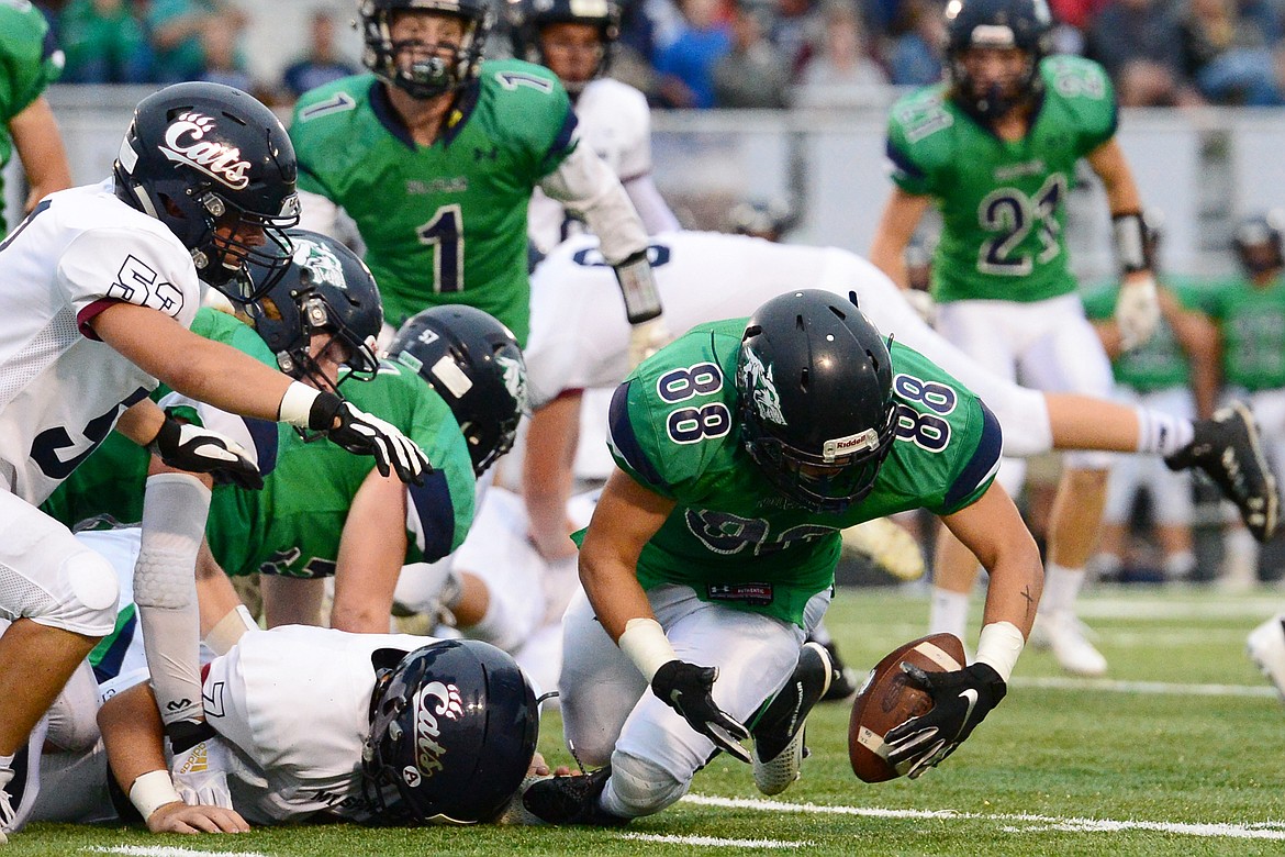 Glacier defensive lineman George Herne (88) scoops up a fumble for a turnover in the first quarter against Mount Spokane at Legends Stadium on Friday. (Casey Kreider/Daily Inter Lake)