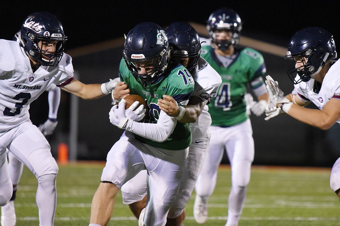Glacier wide receiver Jonah Pate (19) is tackled after making a reception in the third quarter against Mount Spokane at Legends Stadium on Friday. (Casey Kreider/Daily Inter Lake)
