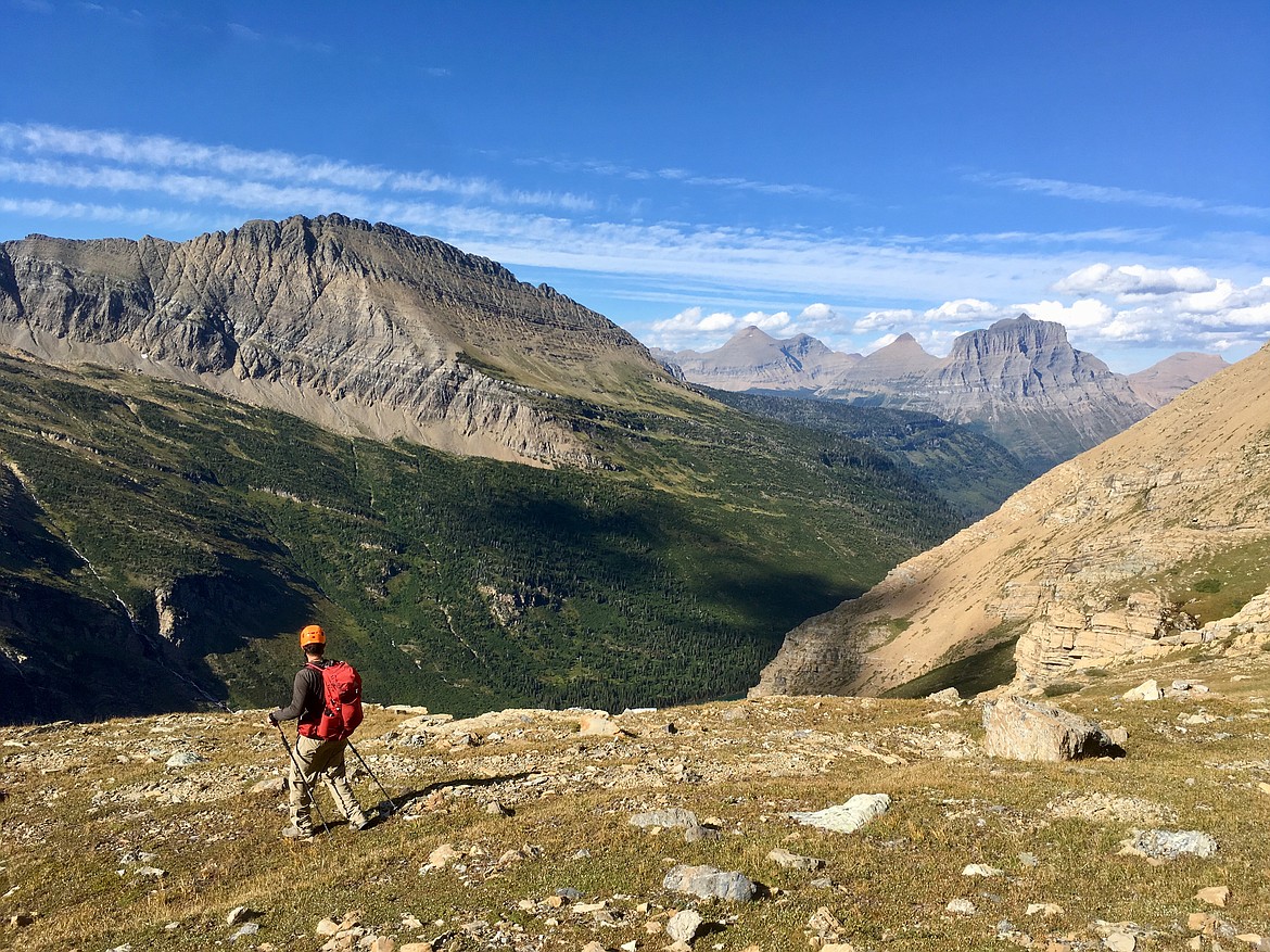 Rick Laverty walks across an alpine meadow below Mount Jackson on Sept. 1 in Glacier National Park. (Matt Baldwin/Daily Inter Lake)