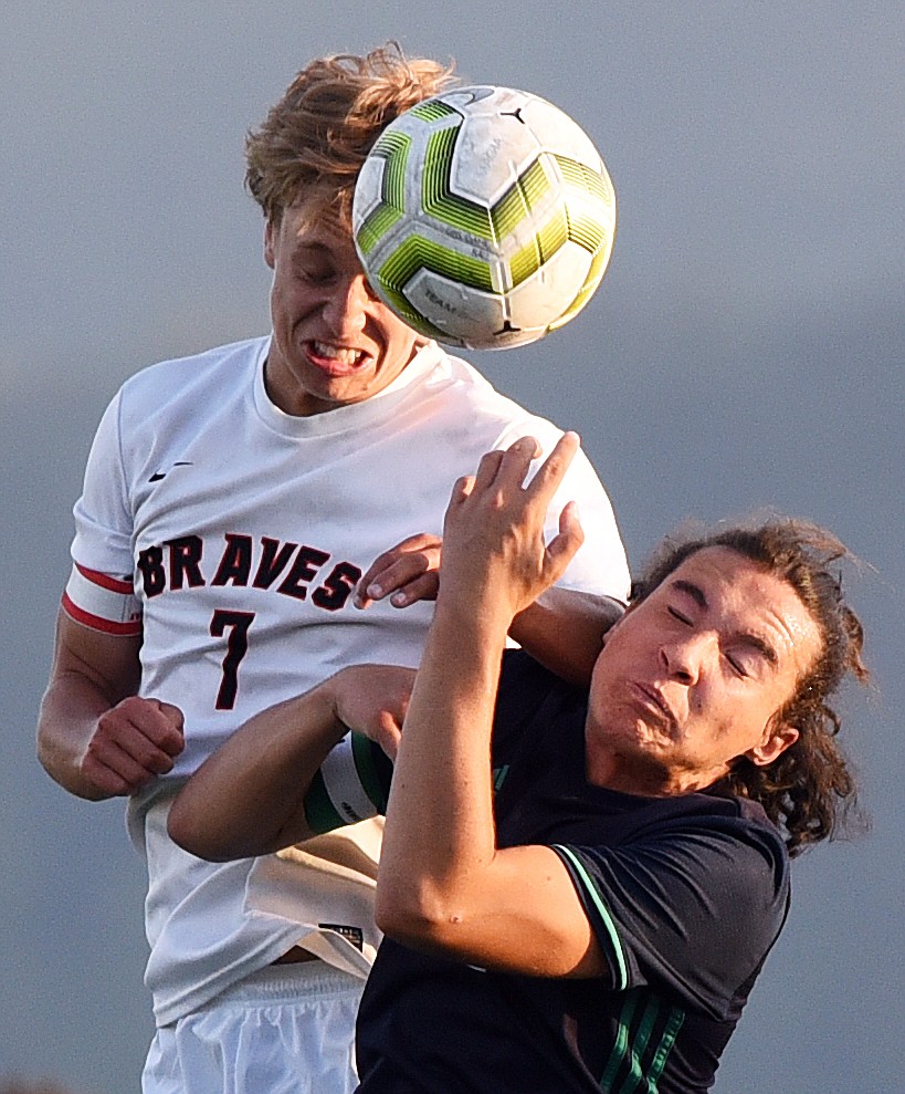 Flathead's Jalen Hawes (7) battles Glacier's Diego Mendoza (2) for a header in the second half during crosstown soccer at Legends Stadium on Thursday. (Casey Kreider/Daily Inter Lake)