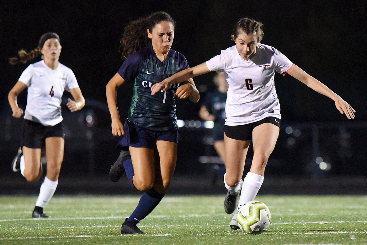 Glacier's Ady Powell (7) and Flathead's True Gannon (6) pursue the ball during crosstown soccer at Legends Stadium on Thursday. (Casey Kreider/Daily Inter Lake)