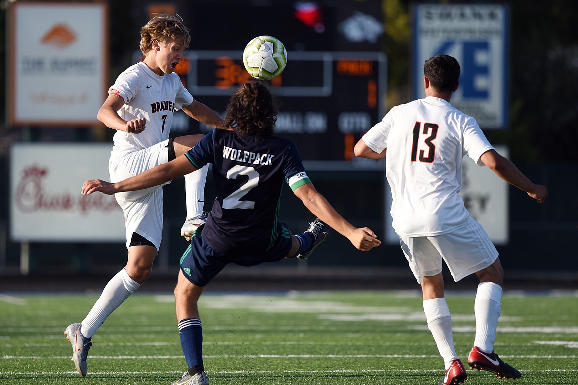 Flathead's Jalen Hawes (7) and Glacier's DIego Mendoza (2) battle for the ball during crosstown soccer at Legends Stadium on Thursday. (Casey Kreider/Daily Inter Lake)