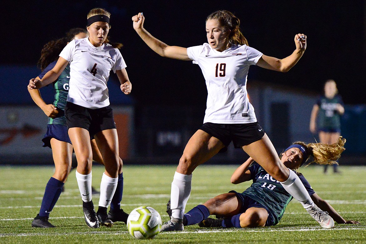 Flathead's Bridget Crowley (19) defends against Glacier's Madison Becker (18) during crosstown soccer at Legends Stadium on Thursday. (Casey Kreider/Daily Inter Lake)