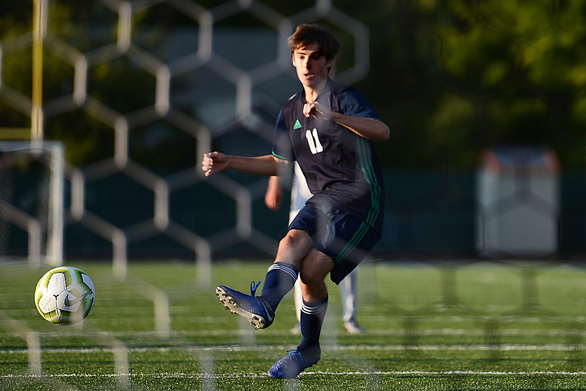 Glacier's Zane Elliott (11) scores on a penalty kick in the second half against Flathead during crosstown soccer at Legends Stadium on Thursday. (Casey Kreider/Daily Inter Lake)