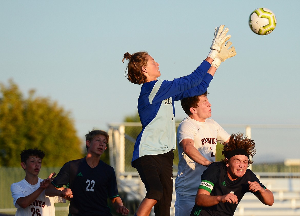 Glacier goalkeeper John Pyron (1) makes a leaping save against Flathead during crosstown soccer at Legends Stadium on Thursday. (Casey Kreider/Daily Inter Lake)