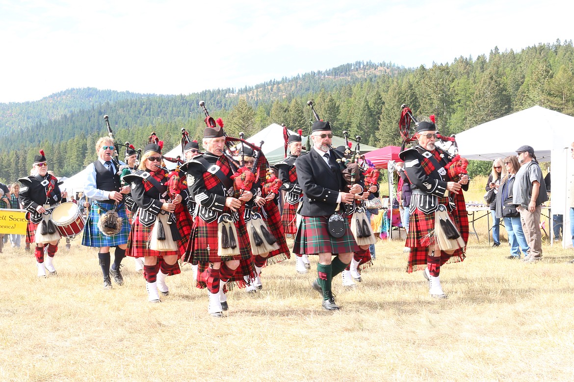 The Flathead Celtic Festival Grand Entrance. Flags and pipers lead the parade at noon Saturday to usher in the start of the games. Clans, families and athletes follow. (Photo courtesy of Leif Appling)