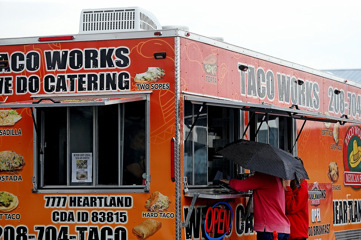 Customers order at Taco Works during a rainy Friday afternoon at the Prairie Food Pavilion. (LOREN BENOIT/Press)