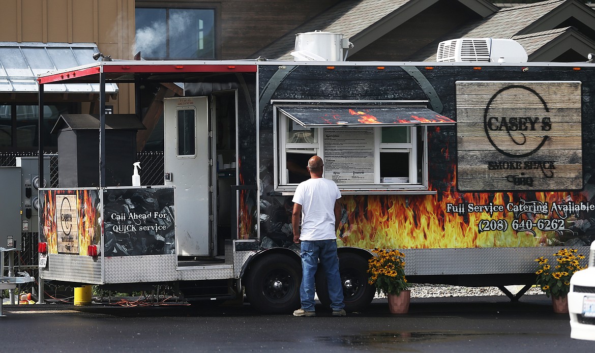 LOREN BENOIT/Press
A customer orders from Casey&#146;s Smoke Shack BBQ food truck at Prairie Pavilion on Friday.