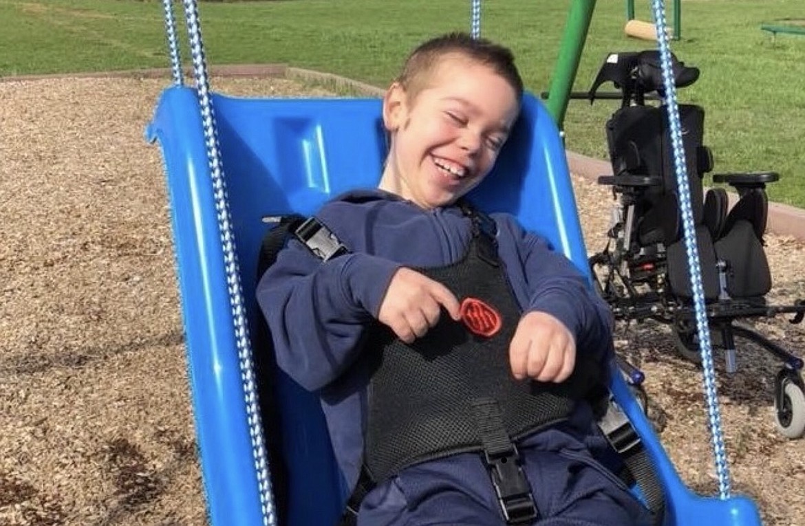 Photo by JENNIFER FERREIRA
Wyatt Blalack smiles and enjoys his swing at school. Wyatt suffered from cerebral palsy and died over the summer on July 26.