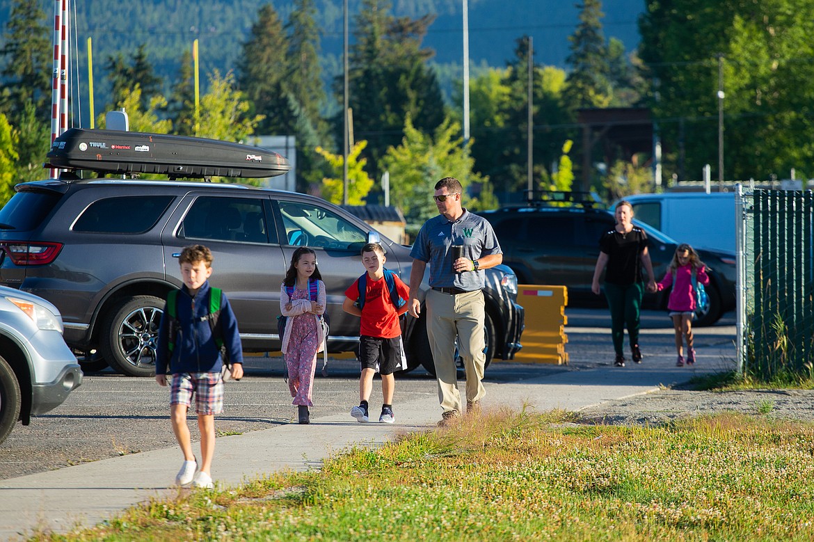 Parents walk their students to school outside Muldown Elementary School last Wednesday. (Daniel McKay/Whitefish Pilot)