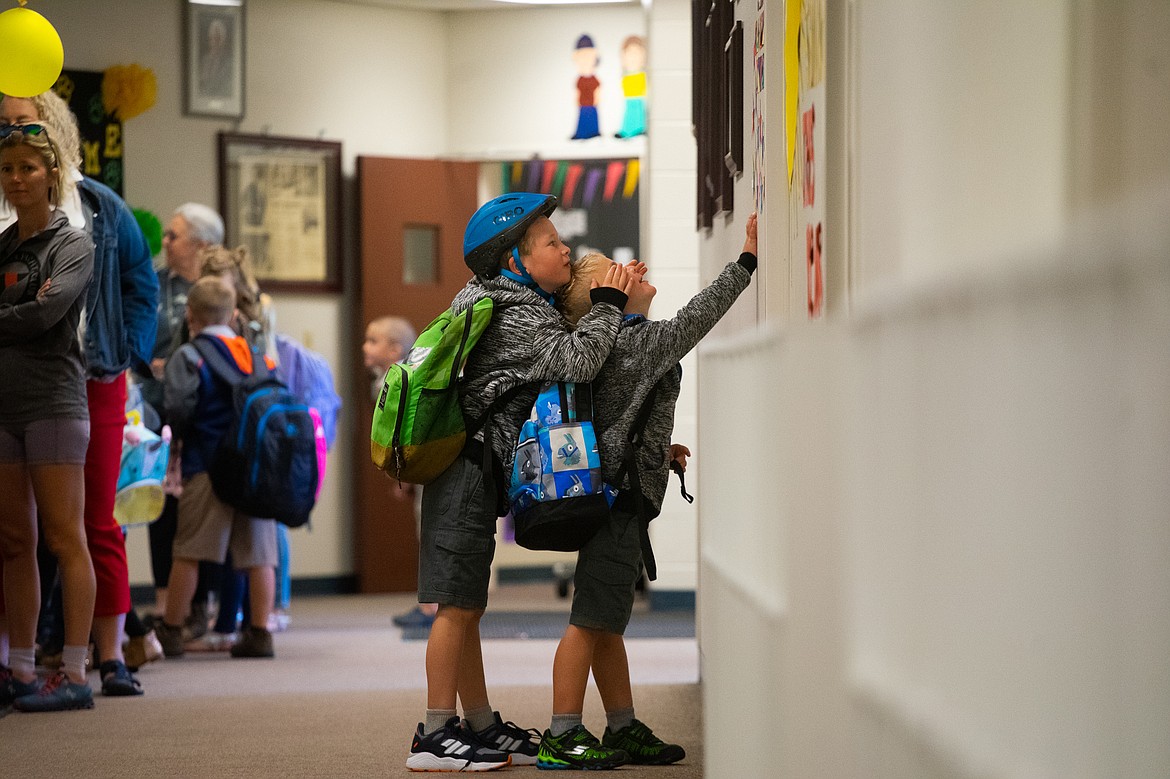 One student messes with another as they wait inside Muldown Elementary for the first day of school. (Daniel McKay/Whitefish Pilot)