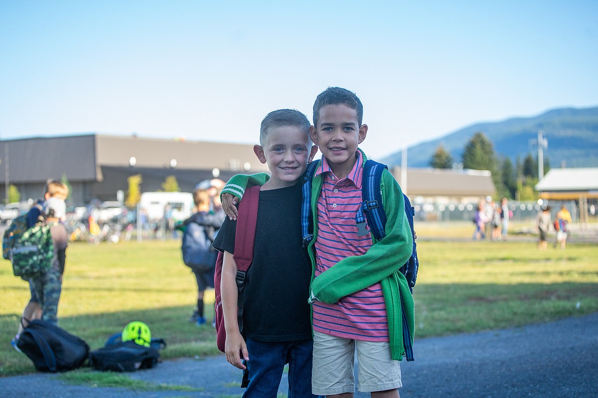 Jackson Walton and Malone Manuel smile for a photo outside Muldown Elementary School last Wednesday. (Daniel McKay/Whitefish Pilot)