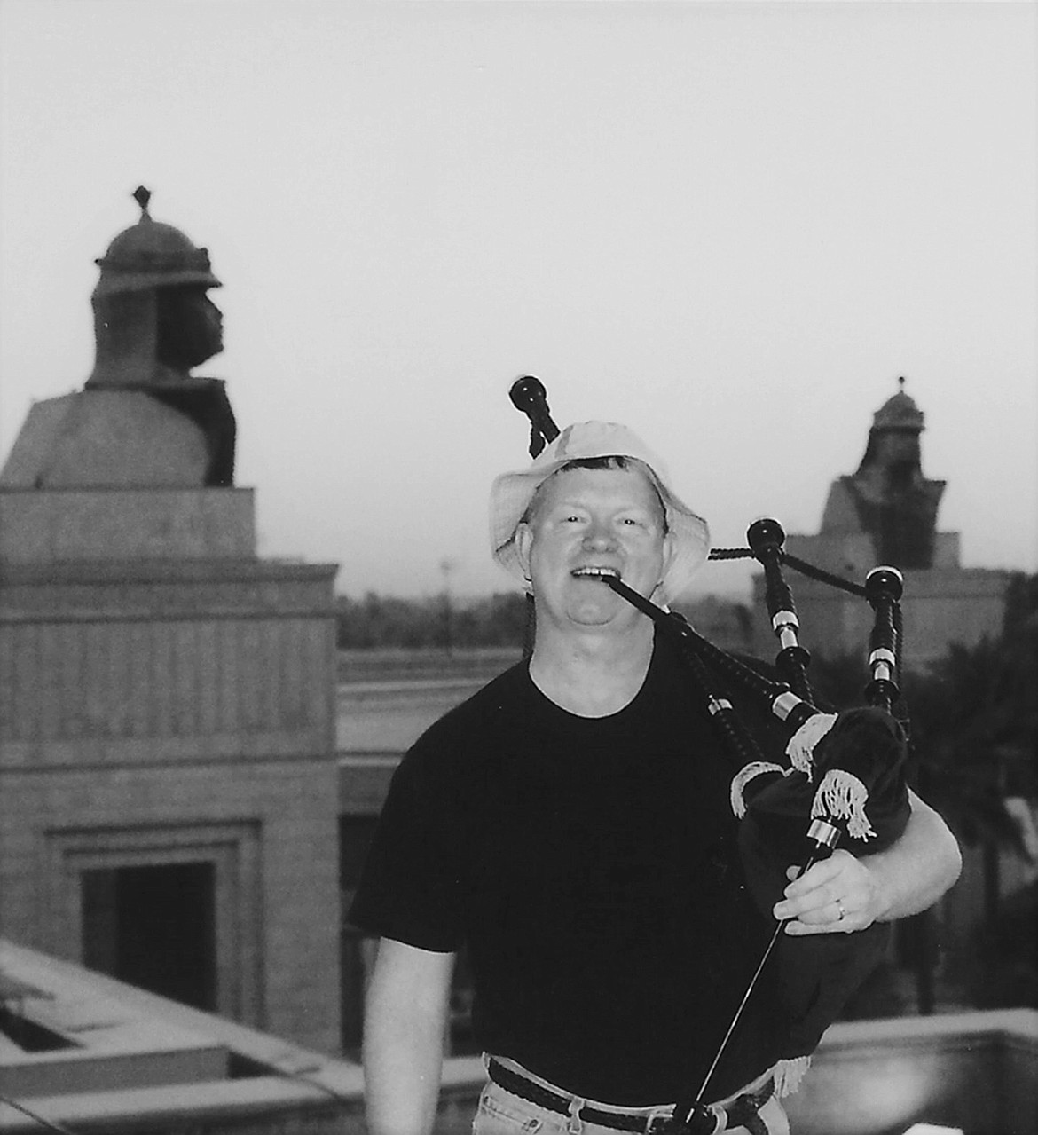 Mike Gilbert pipes at Saddam Hussein&#146;s palace in Baghdad, Iraq in 2003. Gilbert was a U.S. Air Force chaplain and also played bagpipes at military funerals, celebrations and other occasions during his career. (Courtesy of Mike Gilbert)