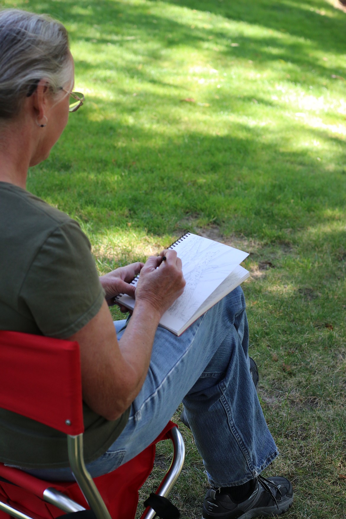 Photo by MANDI BATEMAN
Boundary County Artist Association president, Vicki Bleile, works on a sketch in the Kootenai National Wildlife Refuge.