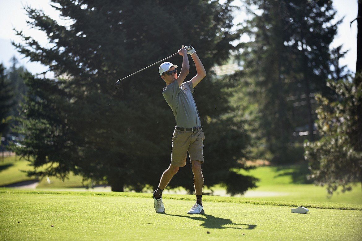 Andrew Brozek hits a drive last week at Whitefish Lake Golf Club. (Daniel McKay/Whitefish Pilot)