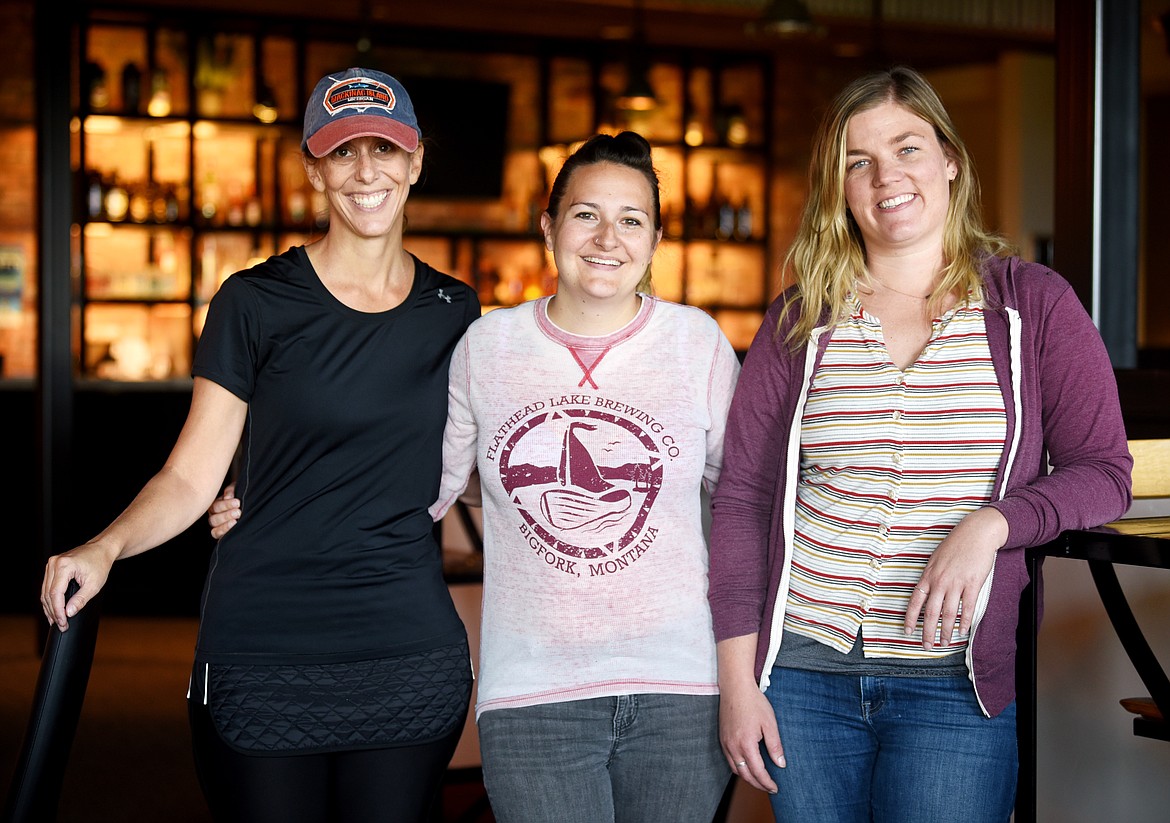 From left, Flathead Lake Brewing Company Pubhouse Owner Sandy Johnston, Pubhouse Manager Nicole Harker and Marketing Manager Sarah Peterson in the Cellar, the new space at the Flathead Lake Brewing Company in Bigfork. (Brenda Ahearn photos/Daily Inter Lake)