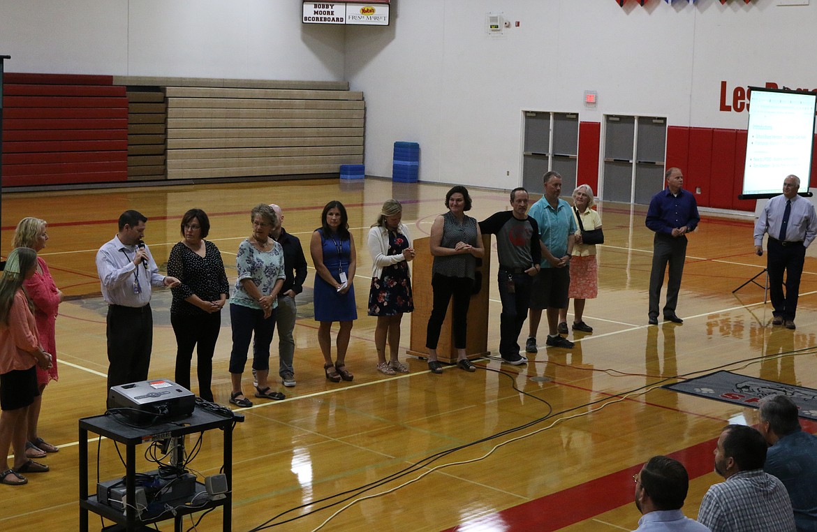 (Photo by MARY MALONE)
School principals of the Lake Pend Oreille School District introduced their new staff members during the annual &#147;Welcome Back Breakfast&#148; at Sandpoint High School on Thursday. Pictured third from left with the microphone, David Miles required an introduction of his own as he was recently hired as the new SHS principal.