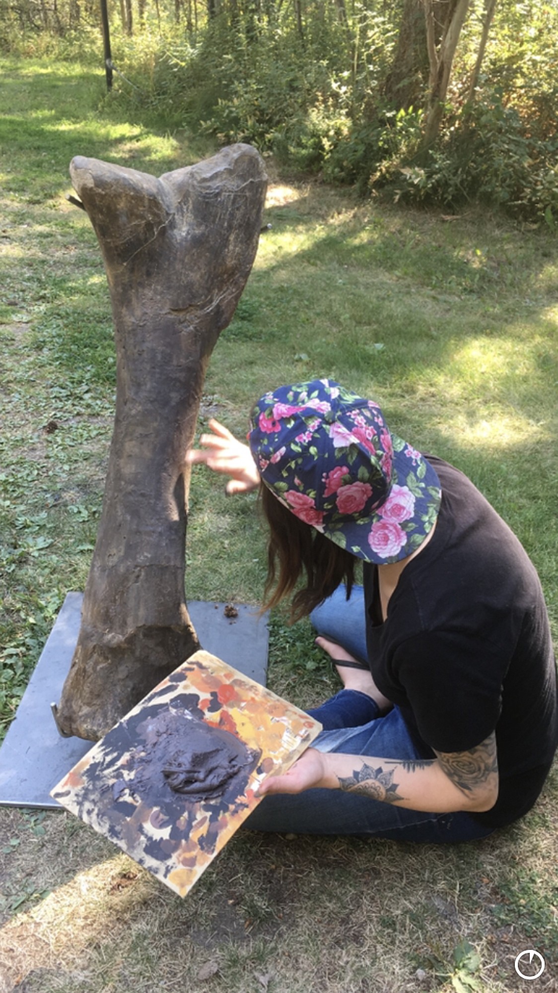 Chantel Ibach preps a large Hypacrosaurus tibia from the Cretaceous Montana Two Medicine Formation. (Courtesy of NorthWest Montana Fossils)