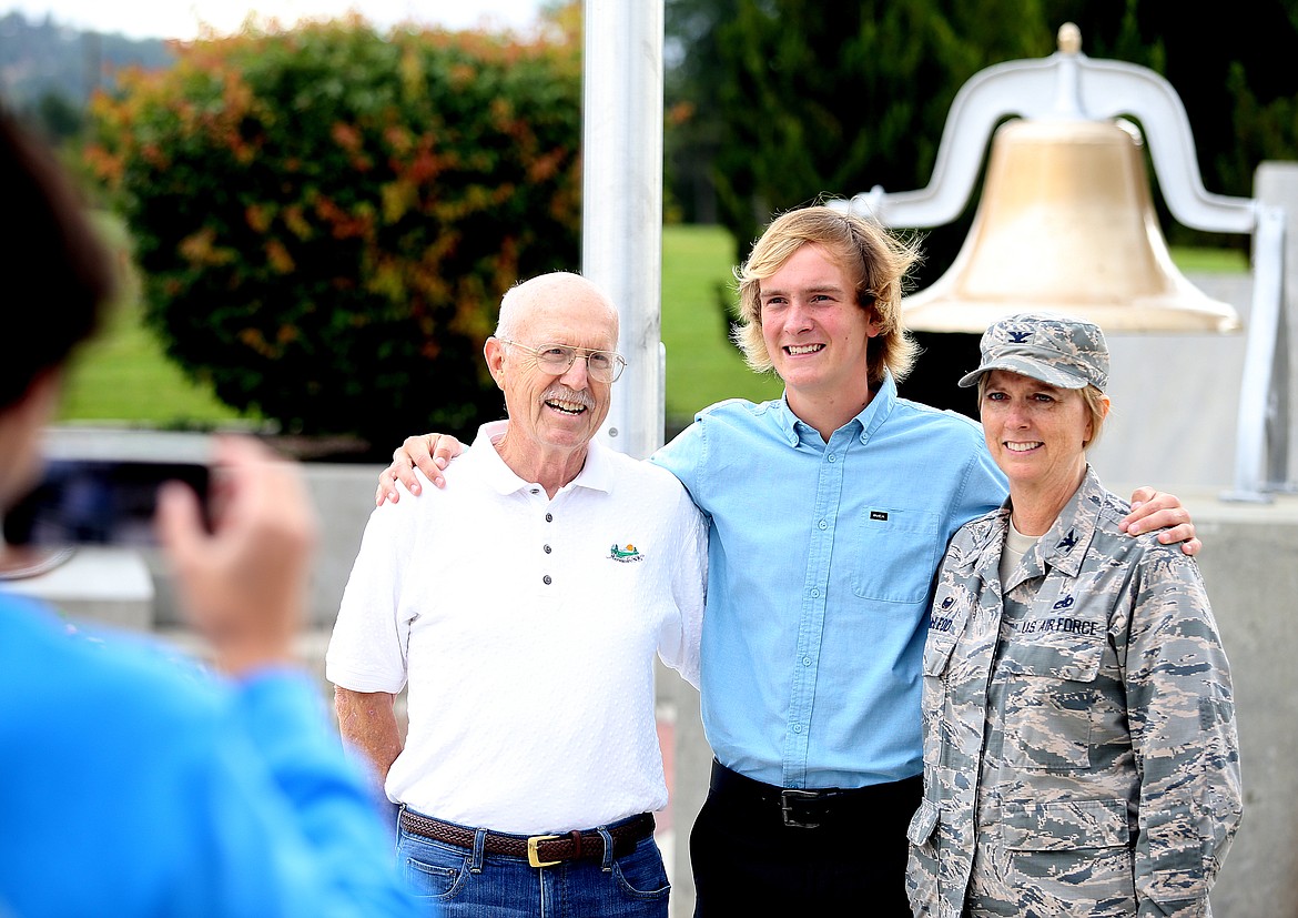 Photos by LOREN BENOIT/Press
19-year-old Connor McMurray, his aunt, Lt. Col. Lisa McLeod and his grandfather, Fred McMurray, snap family photos during Connor&#146;s swearing-in ceremony for the Air National Guard. The bell in the background was on the &#147;Cougar&#148; steam ship where Connor&#146;s great-great-grandfather worked.