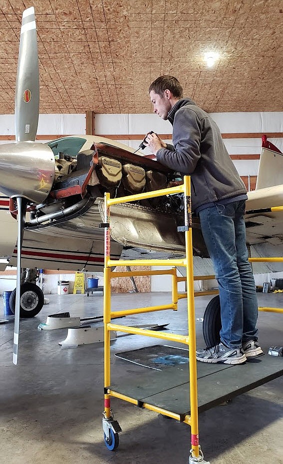 Courtesy photo
Staff Mechanic Joel Price performs an inspection on Latitude Aviation&#146;s Cessna 310 Multi-Engine Trainer.