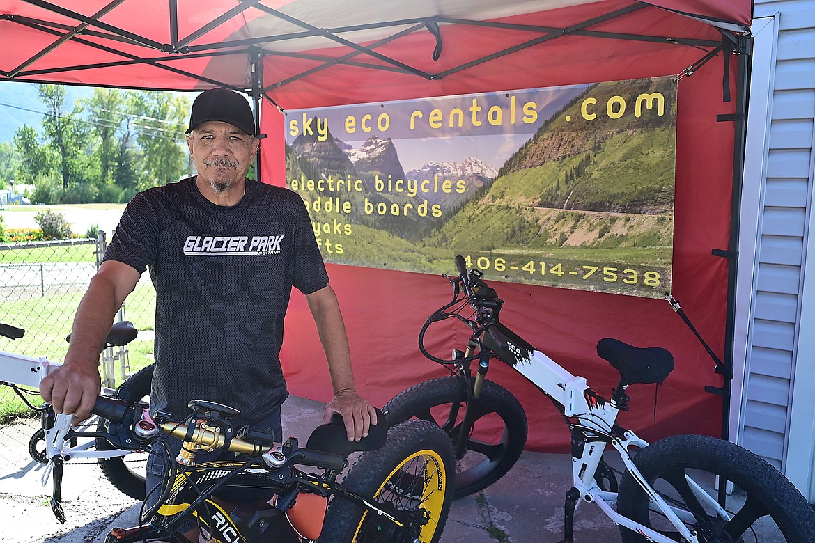 Ed Albrite with an e-bike at his bike rental business in Columbia Falls in this file photo.