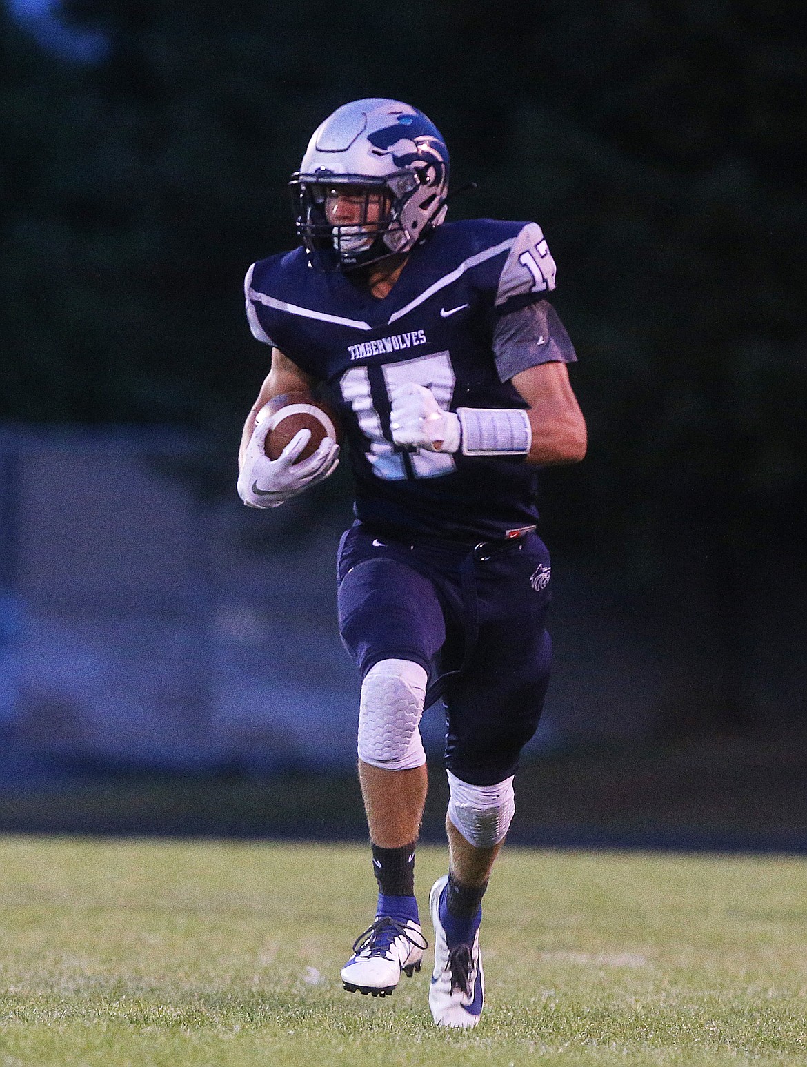 Lake City wide receiver Matthew Whitcomb catches the ball and runs up field against Ferris. (LOREN BENOIT/Press)