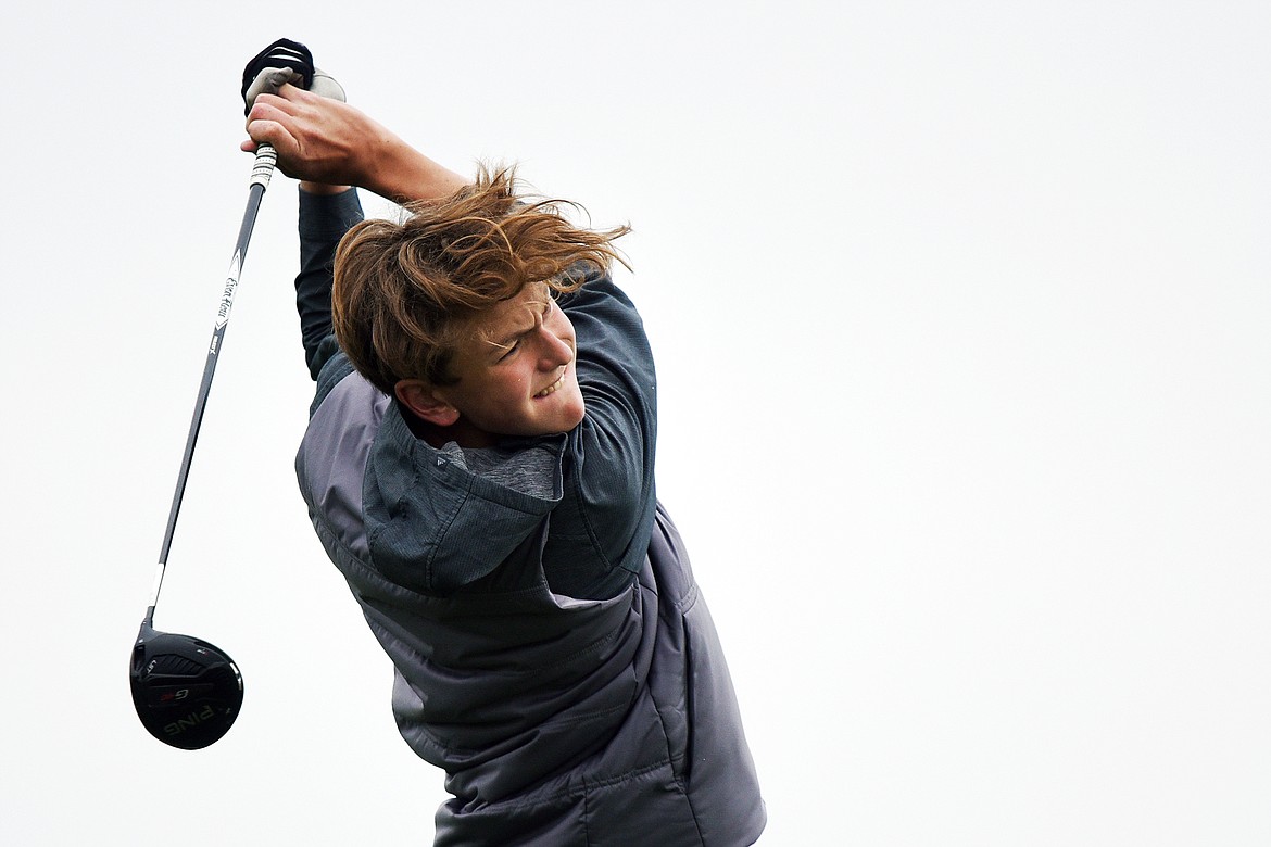 Flathead's Ezra Epperly watches his drive on the eleventh hole during the Kalispell Invite at Northern Pines Golf Club on Wednesday. (Casey Kreider/Daily Inter Lake)