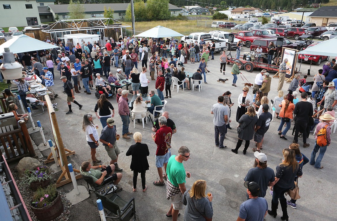 Hundreds flock to the Spinnker Bar parking lot for the beer fest and chili cook-off prior to the annual wiener dog races Saturday, Sept. 14. (Mackenzie Reiss/Daily Inter Lake)