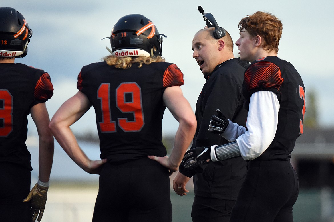 Flathead head coach Matt Upham talks to his team during a time out against Missoula Sentinel at Legends Stadium on Friday. (Casey Kreider/Daily Inter Lake)