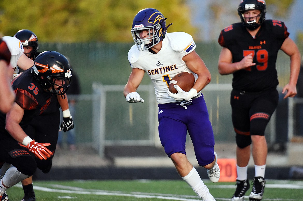 Missoula Sentinel running back Jaxon Lee (1) looks to get around the edge against Flathead at Legends Stadium on Friday. (Casey Kreider/Daily Inter Lake)