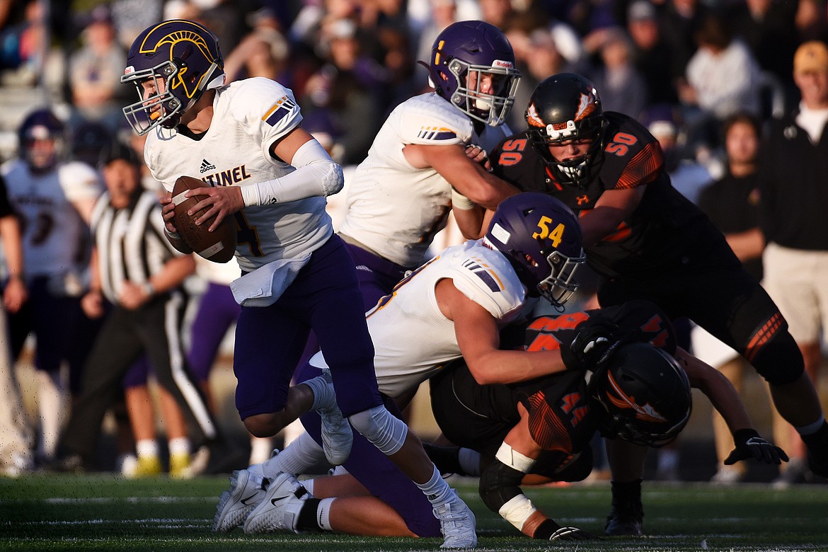 Missoula Sentinel quarterback Dayton Bay (4) scrambles for a gain against Flathead at Legends Stadium on Friday. (Casey Kreider/Daily Inter Lake)