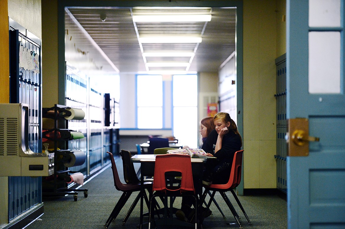 Two fifth-grade students study at a table  in a hallway at Glacier Gateway Elementary School in Columbia Falls on Wednesday, Sept. 11. (Casey Kreider/Daily Inter Lake)