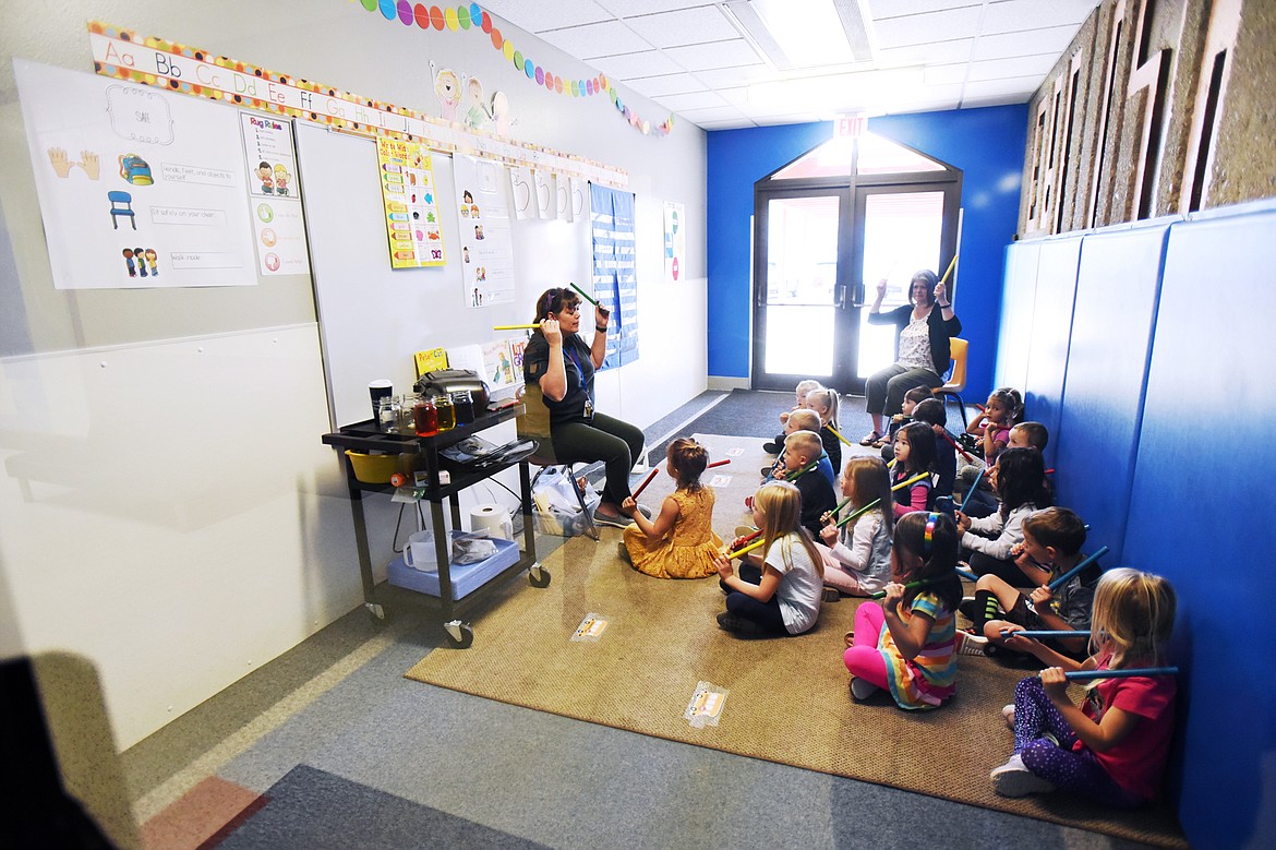 Kindergarten students play musical instruments in an entryway that has been converted into a temporary classroom at Ruder Elementary School in Columbia Falls on Wednesday. (Casey Kreider photos/Daily Inter Lake)