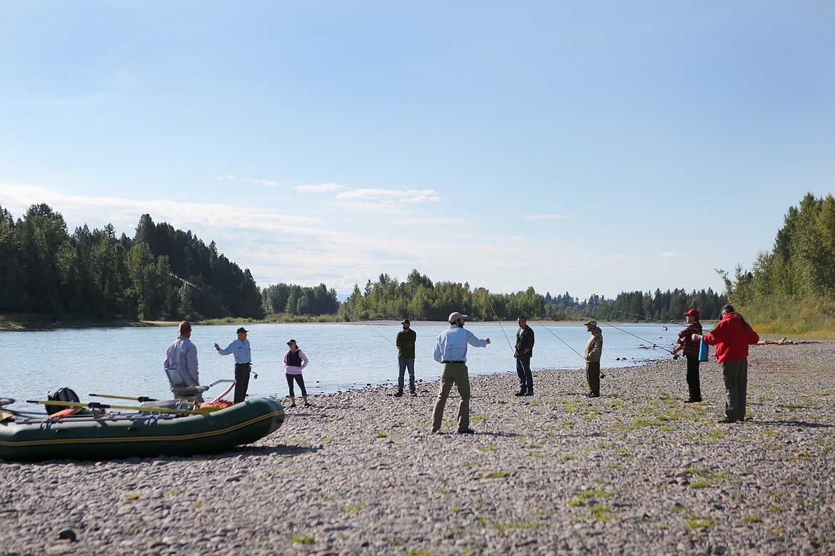 Six veterans from the Kalispell Vet Center prepare for a day of fly fishing on the Flathead River with members and board members of Flathead Valley Trout Unlimited. (Mackenzie Reiss/Daily Inter Lake)