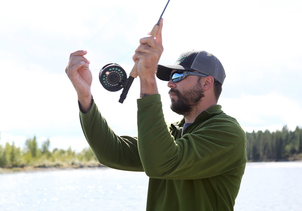 Army veteran Travis Wobschall casts from the boat during the Sept. 12 Trout Unlimited fishing outing.