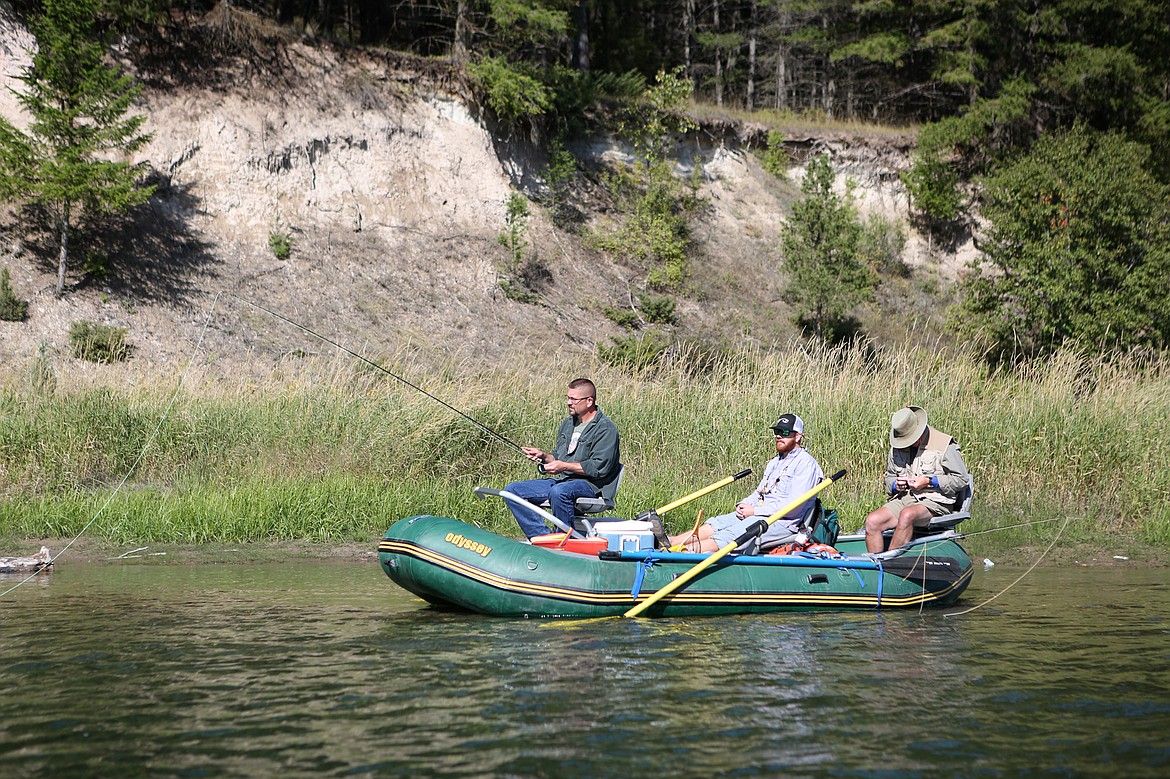 Veteran Jason Varner, of Bigfork, fishes off the front of a raft with Flathead Valley Trout Unlimited members. (Mackenzie Reiss/Daily Inter Lake)