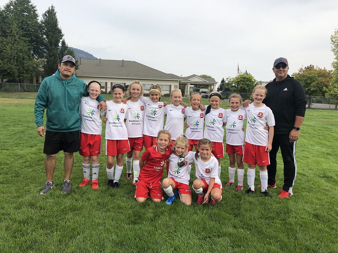 Courtesy photo
The Thorns North FC 09 Girls Yellow participated in the Pend Oreille Cup last weekend in Sandpoint. The Thorns tied their first game 1-1 (Olivia Smith, 1 goal), won their second game 2-1 (Nell Dodge-Hutchins and Chloe Burkholder, 1 goal each) and won their third game 2-1 (Ashley Yates, 2 goals). In the front row from left are Madeline Witherwax, Cadyn Leonard, and Catherine Storey; and back row from left, coach Tomas Barrera, Jakobi Jameson, Chloe Burkholder, Taryn Young, Mallory Morrisroe, Olivia Smith, Brooklyn Leen, Ashley Yates, Audrey Linder, Nell Dodge-Hutchins and coach Eric Burkholder. Not pictured is Kayla Tenney.