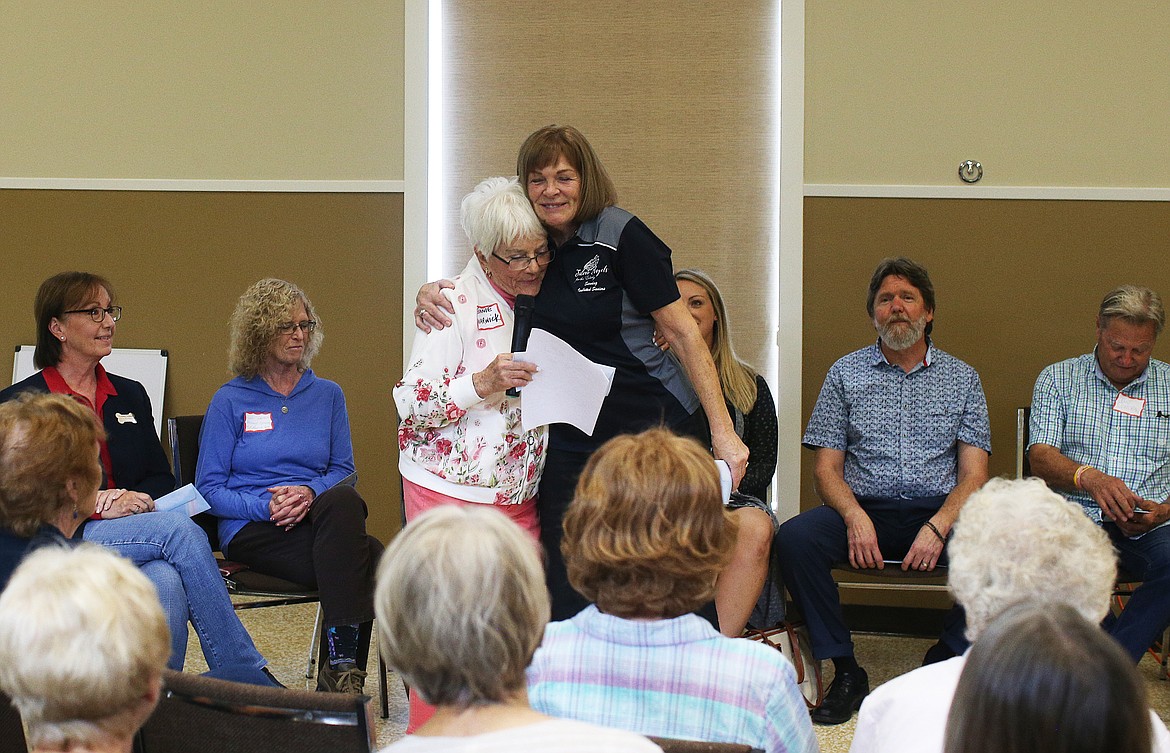 LOREN BENOIT/Press
Silver Angels director Diane Zell, right, shares a hug with Garden Club tour chair Bonnie Warwick during the Garden Club&#146;s distribution event Tuesday at First Baptist Church. Other 2019 Garden Tour recipients: North Idaho College Dual Enrollment; Hayden Meadows Greenhouse Project; Skyway Elementary School; ElderHelp of North Idaho; ICARE (St. Vincent de Paul); Turkeys and More; Shared Harvest Community Garden; Safe Passage Violence Prevention Center; Second Chance Pet Rescue; and Kootenai Humane Society.