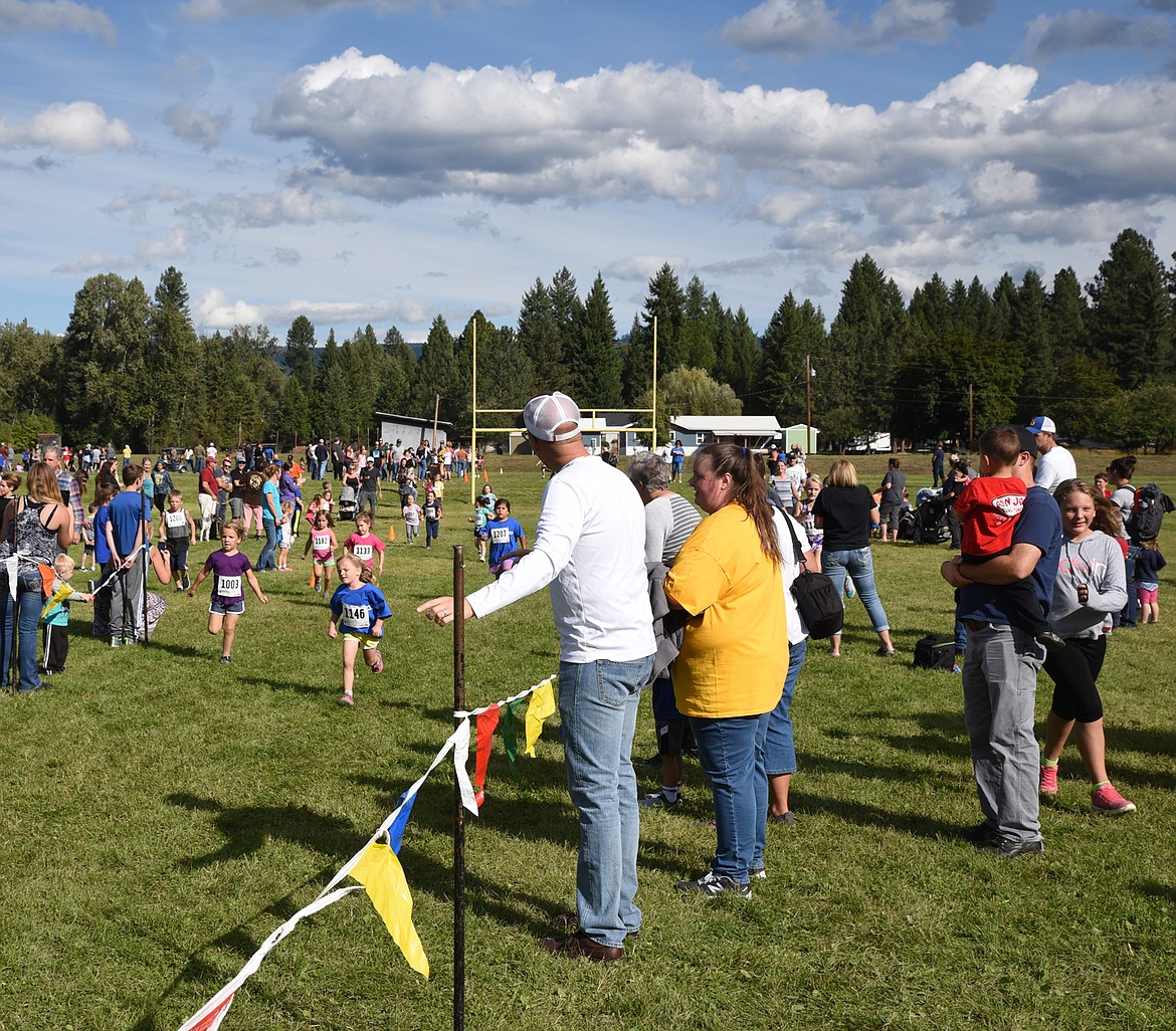 PARENTS AND family members cheer on the kids in the 30th Annual Runnerfell Friday, Sept. 13, at Libby Elementary School. (Scott Shindledecker/The Western News)