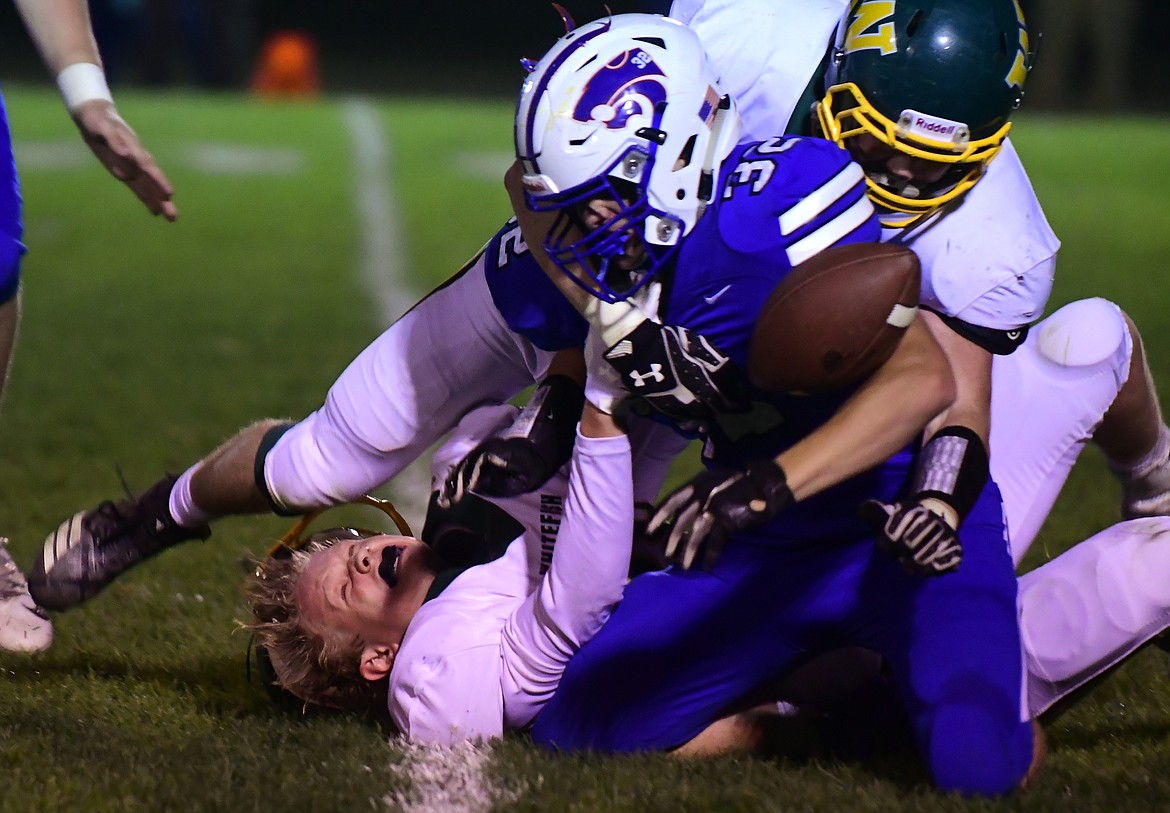 Wildcat runner Finn Coleman is brought down by the facemask is the third quarter Friday. (Jeremy Weber photo)