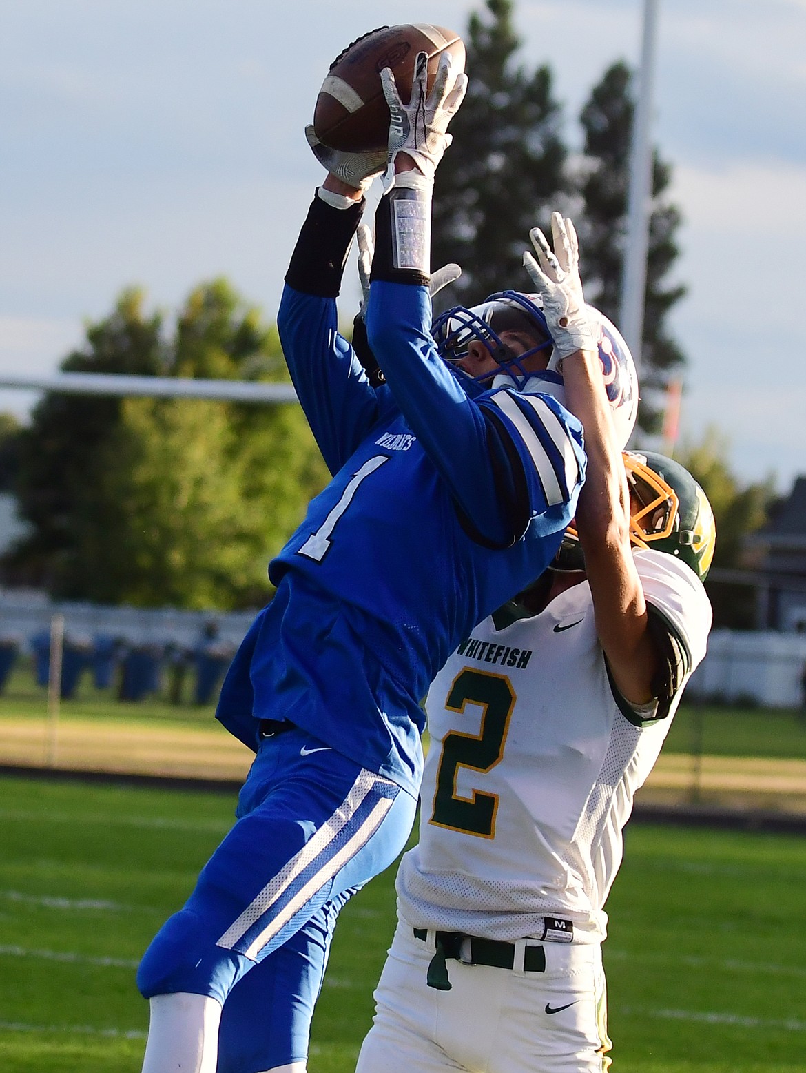 Wildcat Garhet Salminen intercepts a pass intented for Whitefish's Bodi Smith in the first quarter Friday. (Jeremy Weber photo)