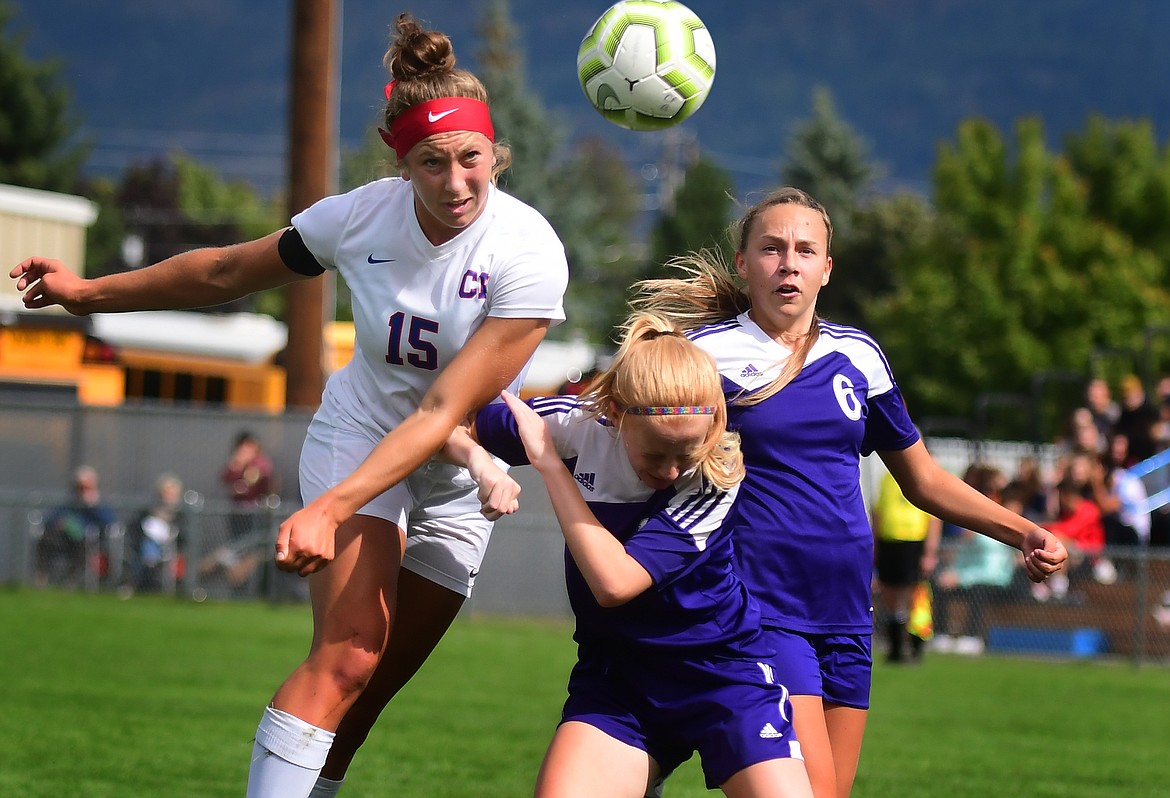 Josie Windauer heads the ball past the Park defense Saturday. Windauer scored a hat trick as the Wildkats won, 6-0. (Jeremy Weber photo)