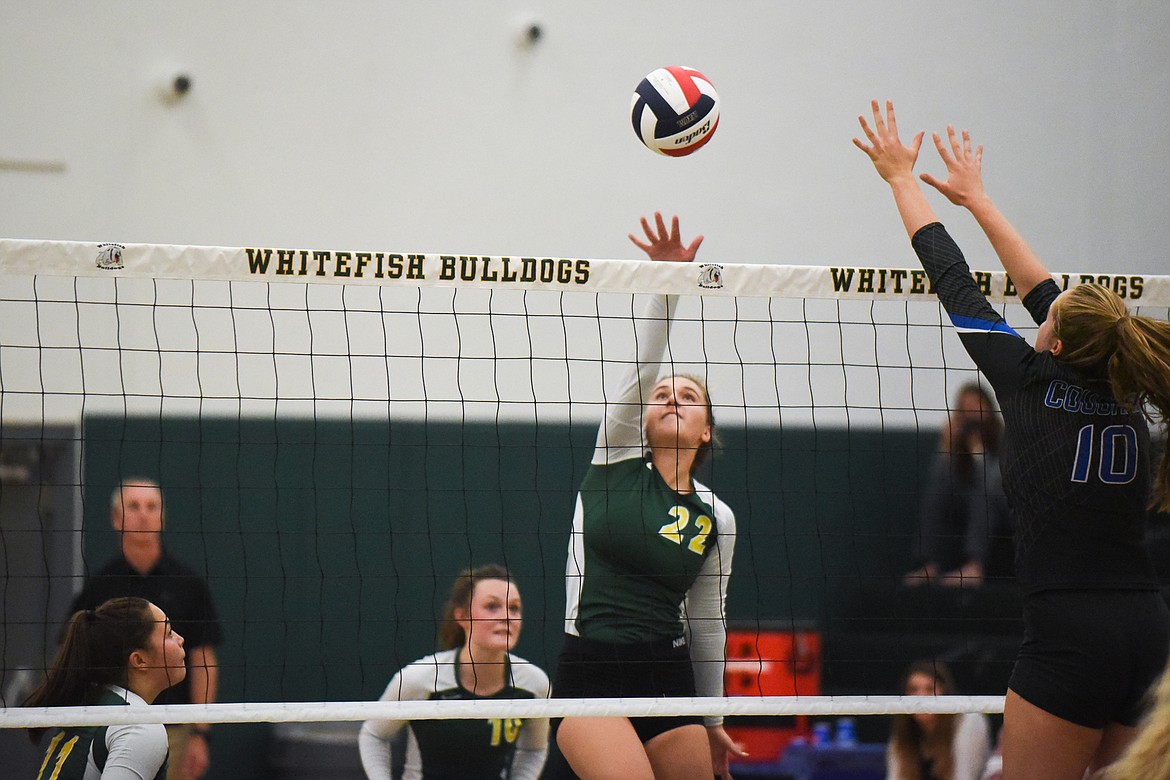 Payton Reisinger rises for the kill against Stillwater last Thursday. (Daniel McKay/Whitefish Pilot)