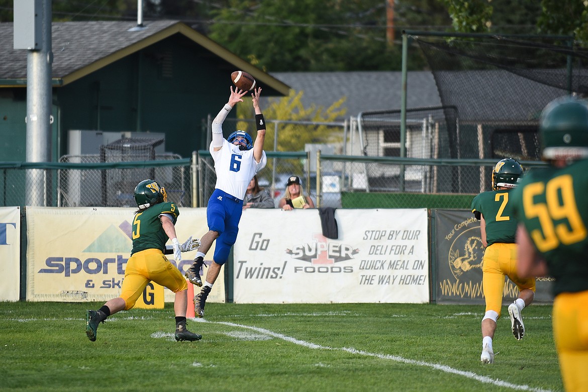 LIBBY&#146;S JEFF Offenbecher rises for the touchdown reception early during the Logger&#146;s 31-0 thrashing of Whitefish on Friday. (Daniel McKay/Whitefish Pilot)